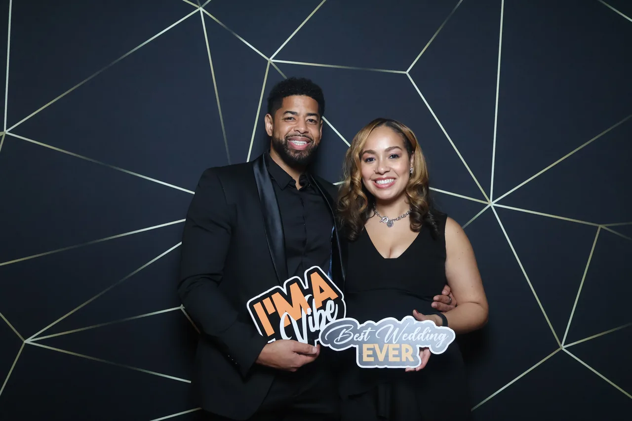 Guests enjoying a Golden Captures photo booth rental — event photo 11