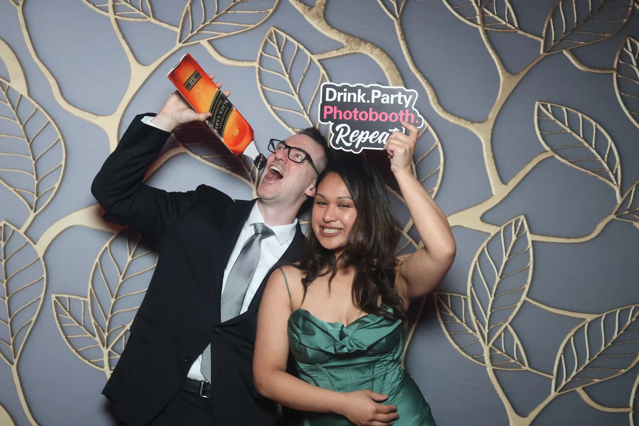 Guests enjoying a Golden Captures photo booth rental — event photo 12