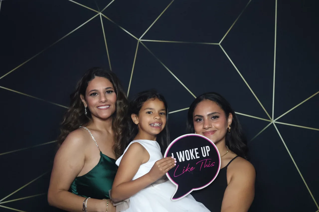 Guests enjoying a Golden Captures photo booth rental — event photo 17