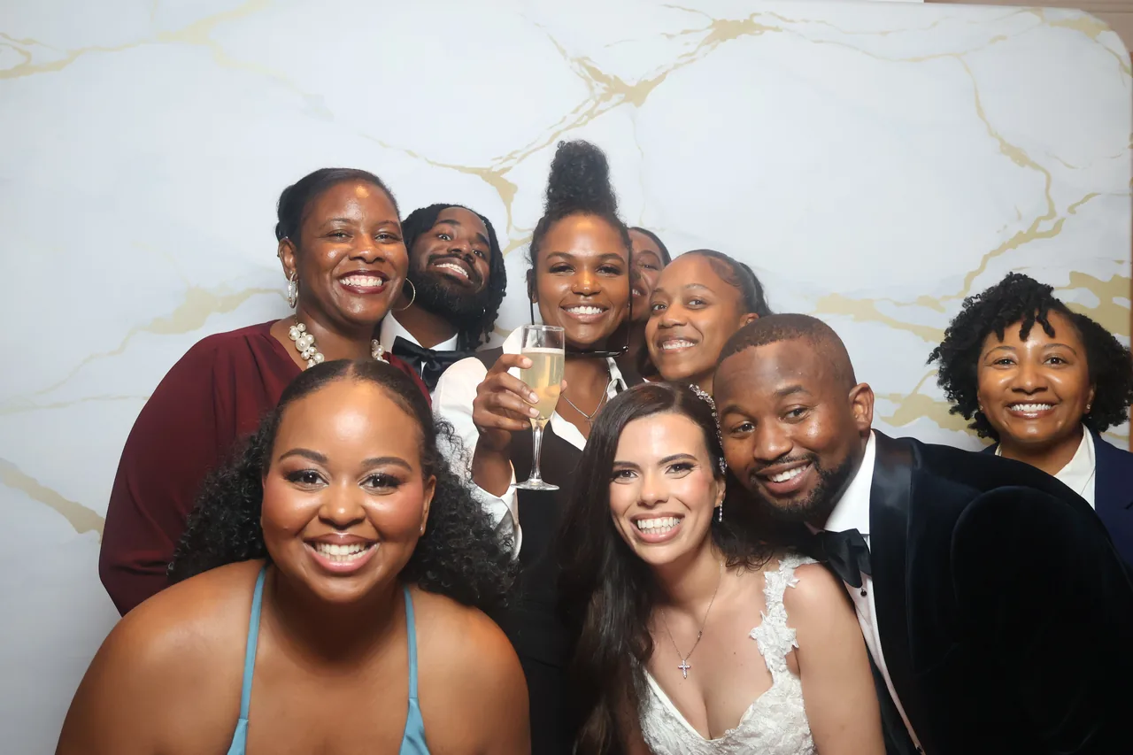 Guests enjoying a Golden Captures photo booth rental — event photo 18
