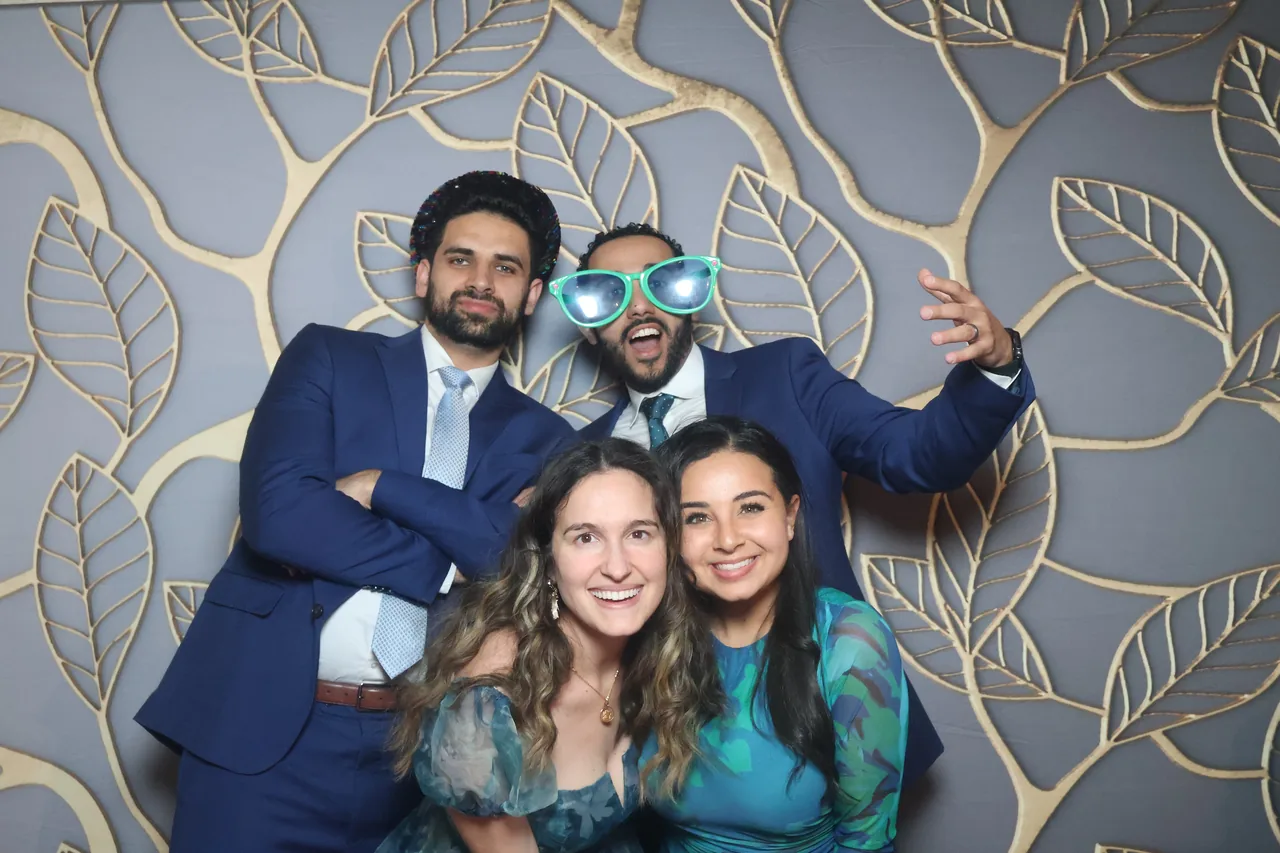 Guests enjoying a Golden Captures photo booth rental — event photo 19
