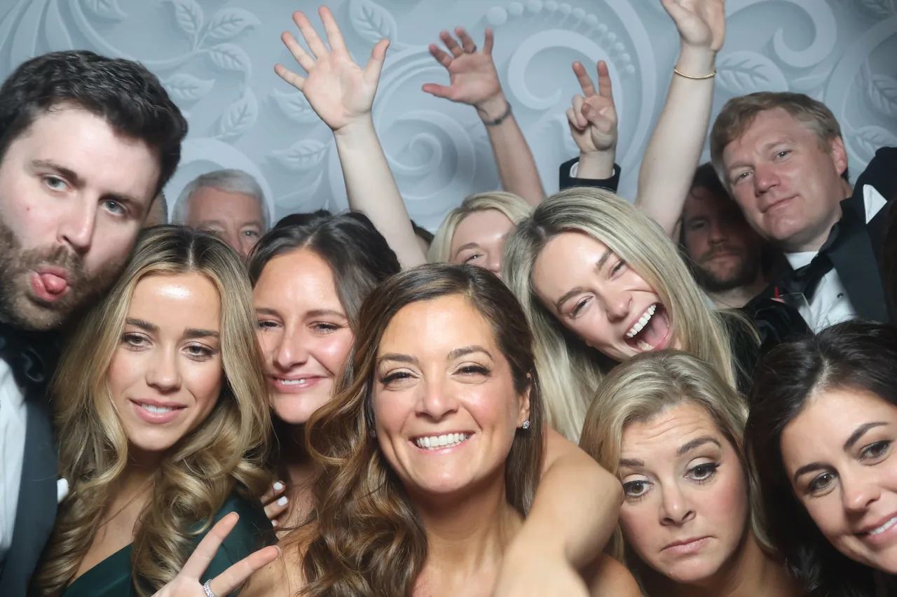 Guests enjoying a Golden Captures photo booth rental — event photo 20
