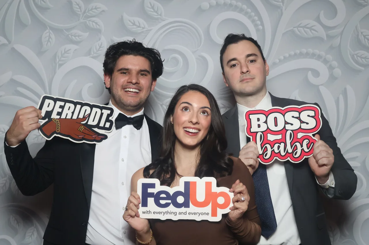 Guests enjoying a Golden Captures photo booth rental — event photo 21