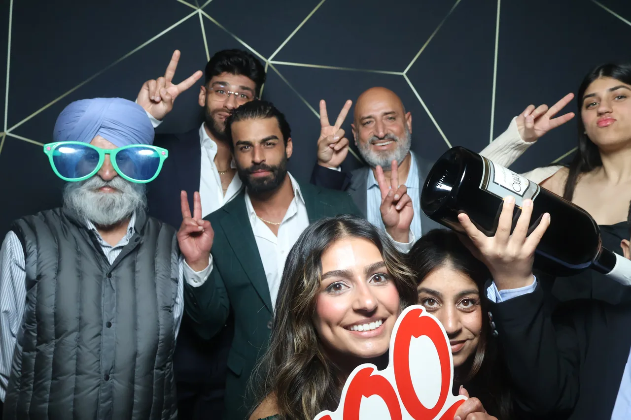 Guests enjoying a Golden Captures photo booth rental — event photo 23