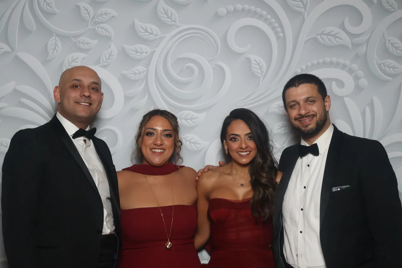 Guests enjoying a Golden Captures photo booth rental — event photo 24