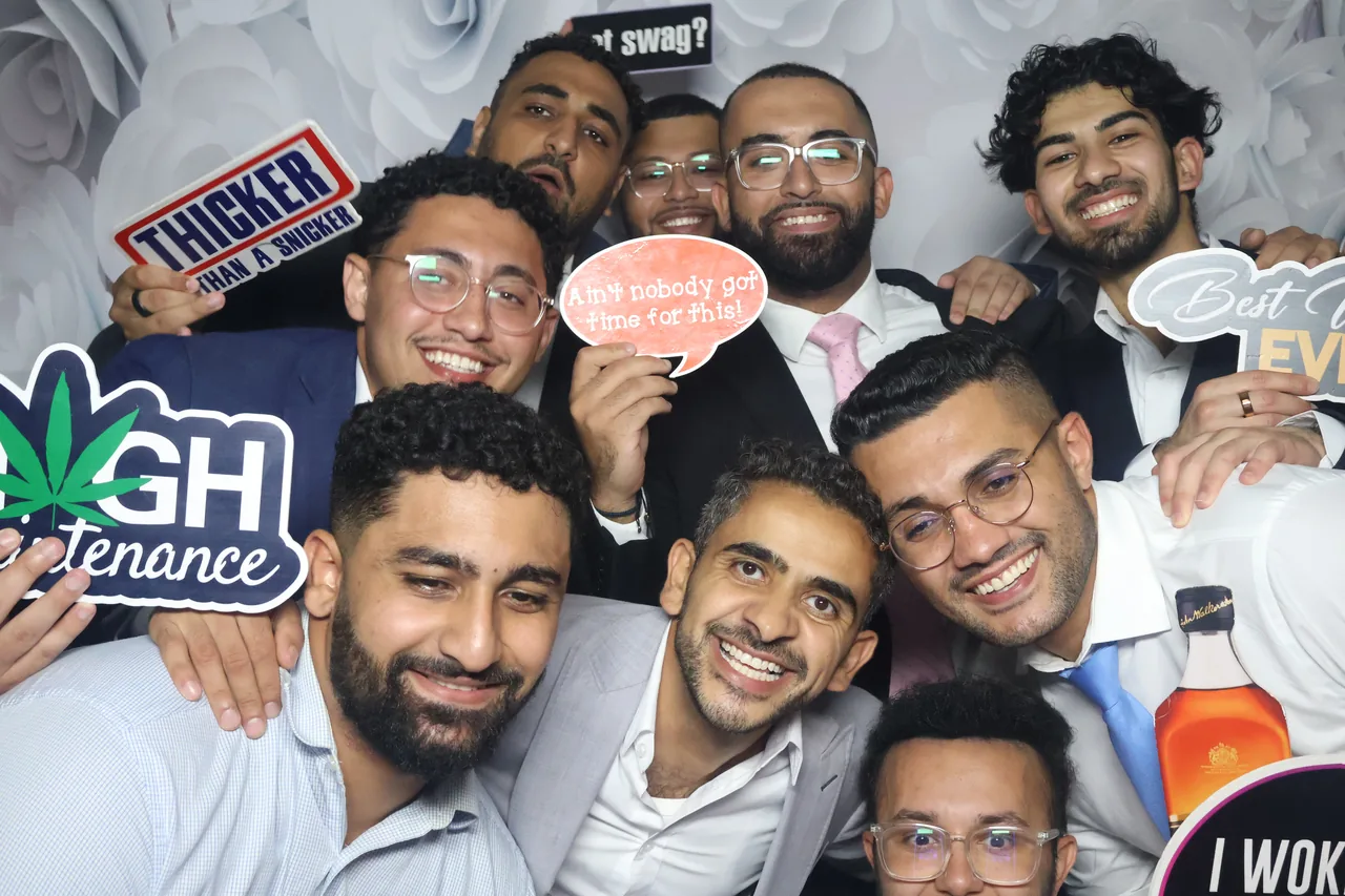 Guests enjoying a Golden Captures photo booth rental — event photo 27
