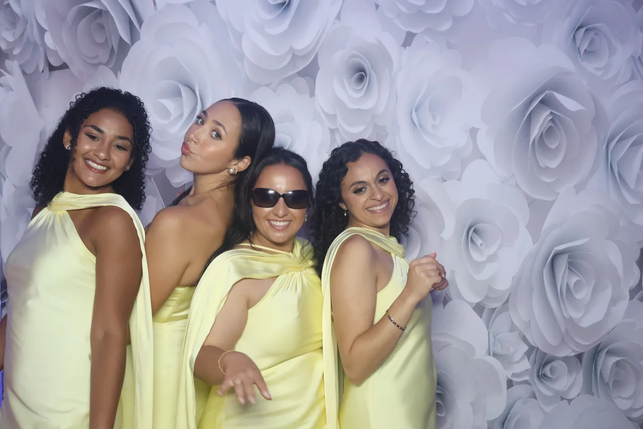Guests enjoying a Golden Captures photo booth rental — event photo 28