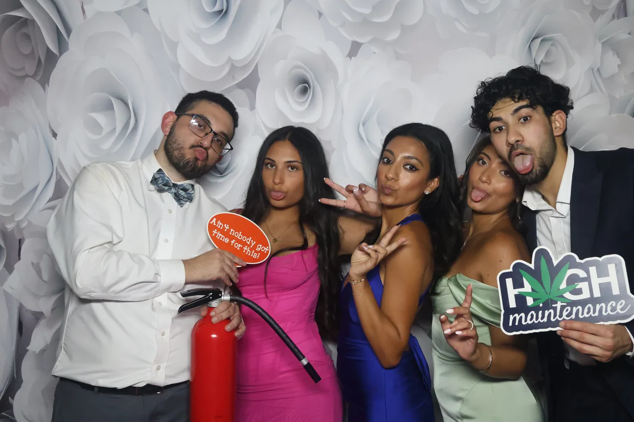 Guests enjoying a Golden Captures photo booth rental — event photo 29