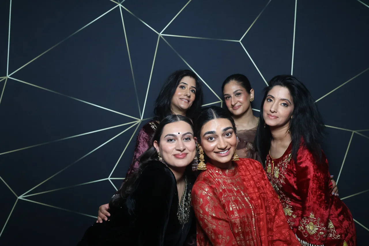 Guests enjoying a Golden Captures photo booth rental — event photo 31