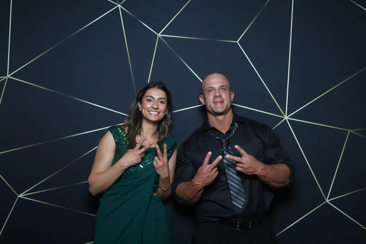 Guests enjoying a Golden Captures photo booth rental — event photo 34